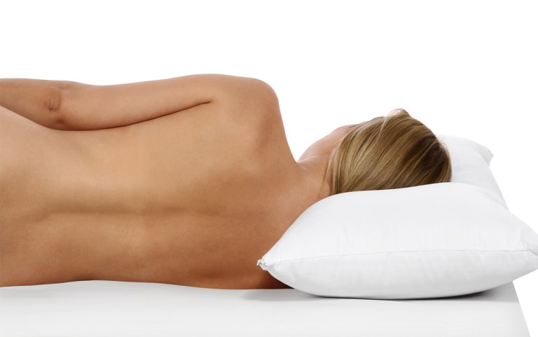 The ideal mattress firmness properly aligns the spine.