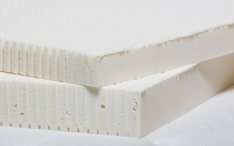 Close up of natural Talalay latex toppers which can be sized to fit any mattress.