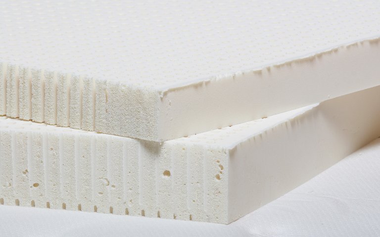 latex-toppers-thickness Close up of natural Talalay latex toppers which can be sized to fit any mattress.